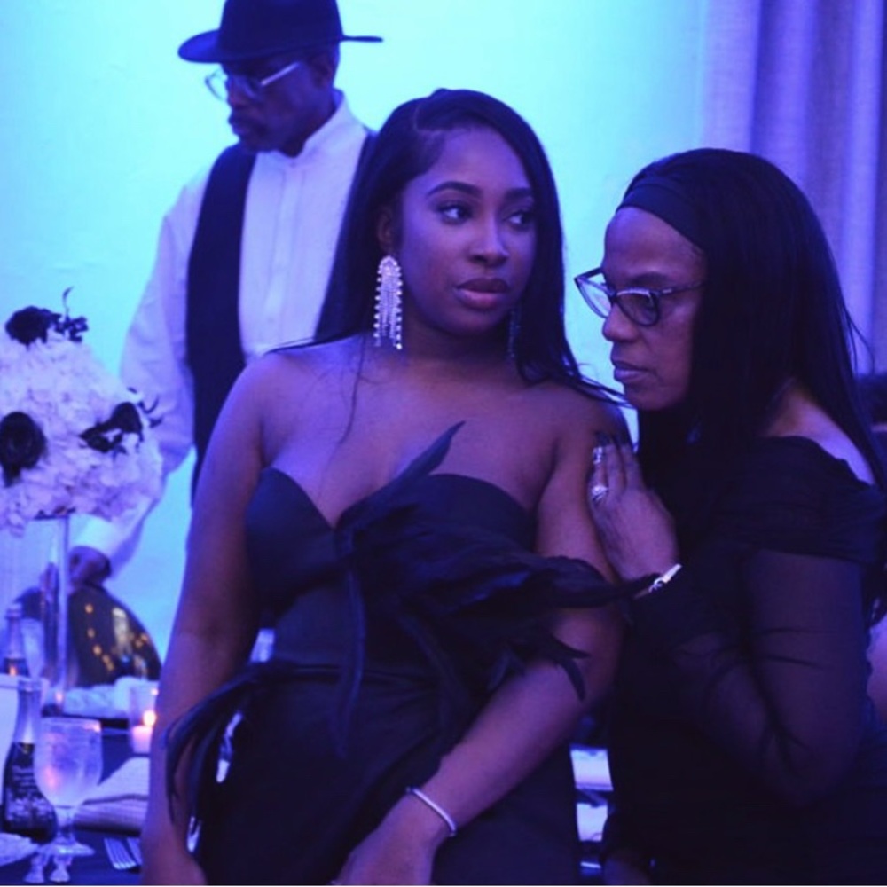 Stylish Black Dress with Feather Accents